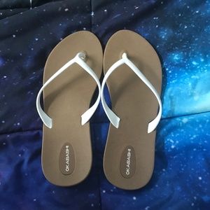 White and brown flip flops
